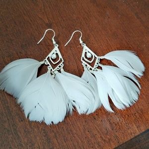 Silver dangling feather glamorous earrings
